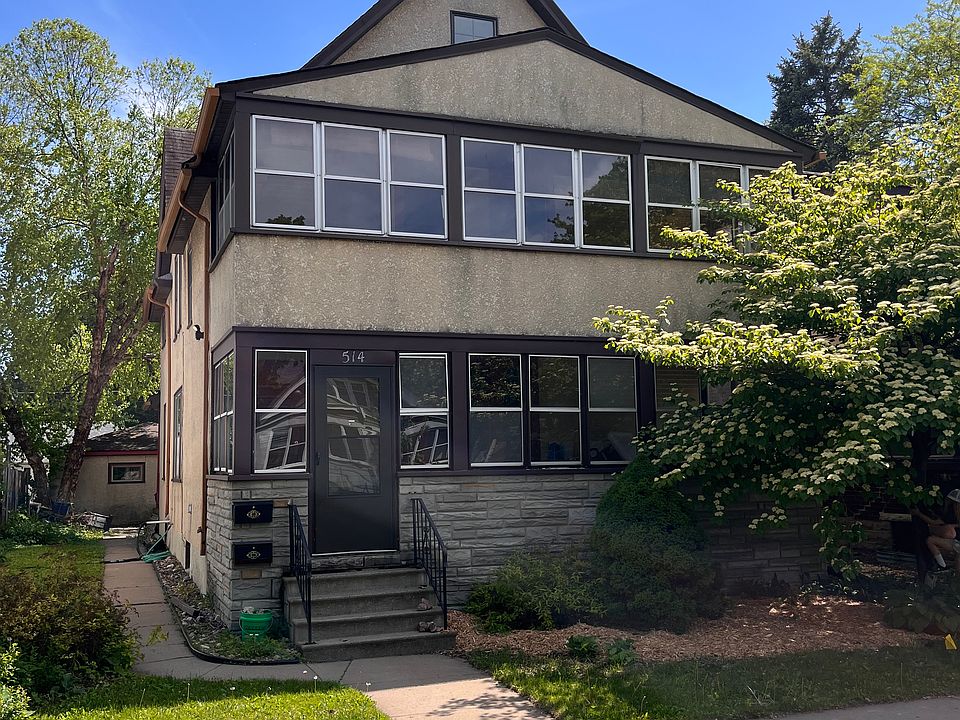 Street view of duplex. Apartment 1 is on the main floor and includes the front porch.