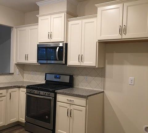 Kitchen, cabinet color is an espresso (photo taken before new fridge was delivered)