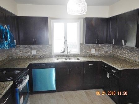 5th image of 9543 S Natoma Ave