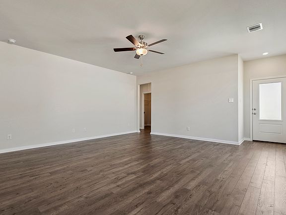 A spacious family room with vinyl flooring