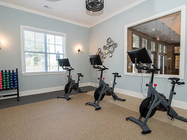 Try out different exercise routines in the fitness center at Millis and Main