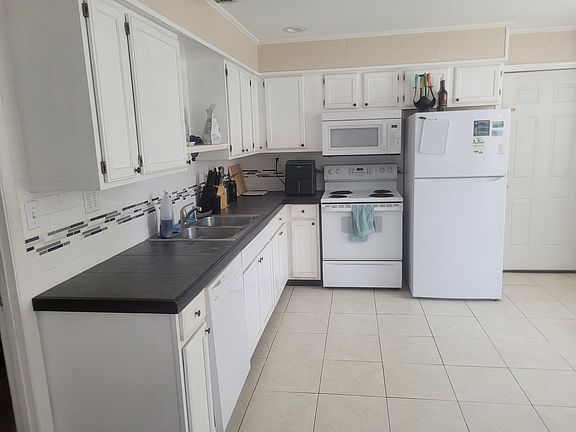Kitchen with large slate counter top and plenty of cabinet space.