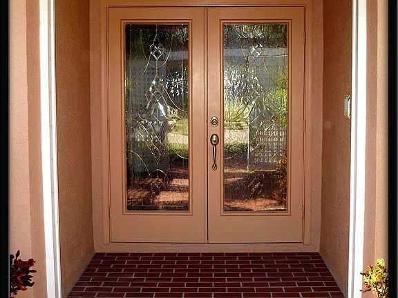 Double glass doors protected by storm shutters