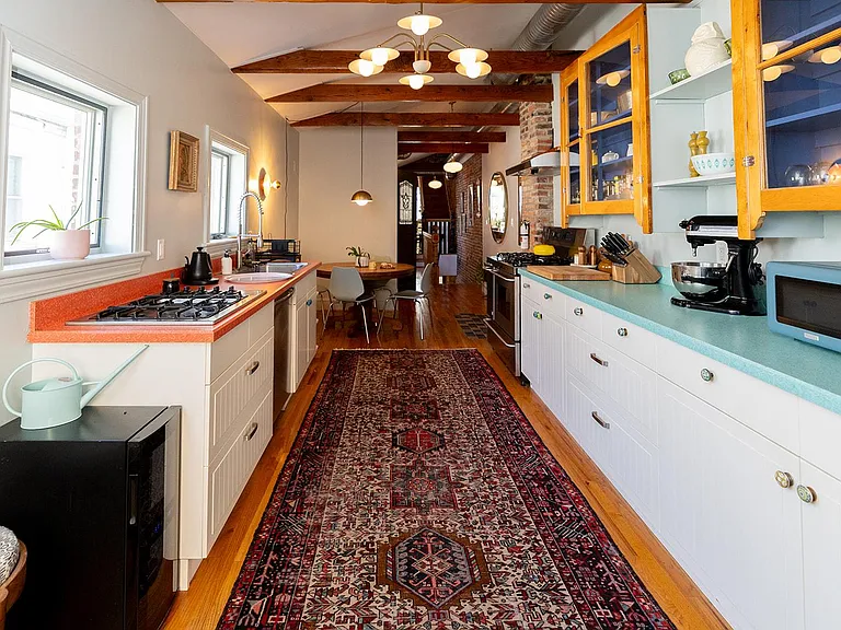 As you step into the Guest House on the 2nd floor, the kitchen and dining room welcomes you into a vintage-meets-modern space with wood-beamed ceilings, oversized fridge, and 2 stove-tops for avid cooks. Make a multi-course meal in our well appointed chef