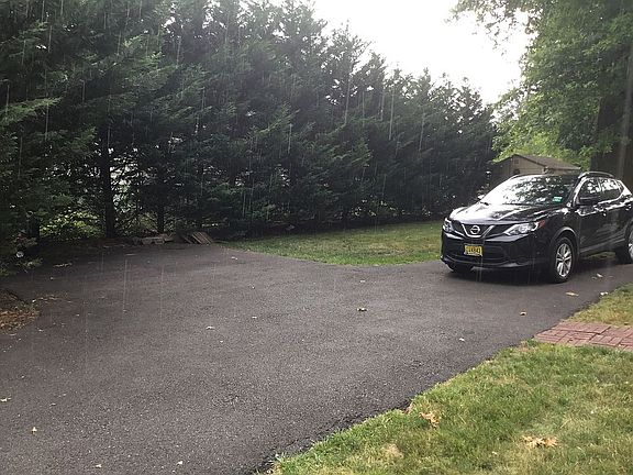 Paved driveway fits up to 4 