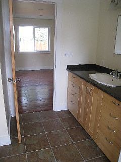 Tile floors in bathrooms and laundry