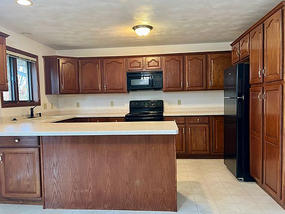 Large kitchen with many cabinets