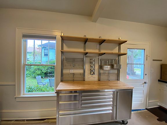 The Kitchen has the original 1926s cabinets along with more modern stainless steel. Again, the beautiful hardwood floors are throughout the entire house and continue throughout the kitchen.