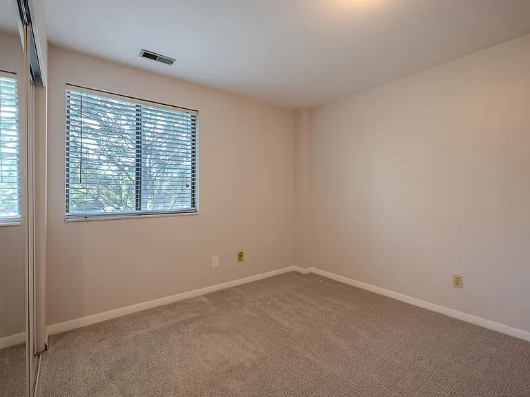 Bedroom 2 with lots of natural light and looking out to grennery outside