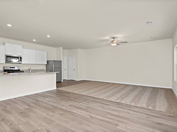 The open layout of the Goodhue has the kitchen open to the familty room.