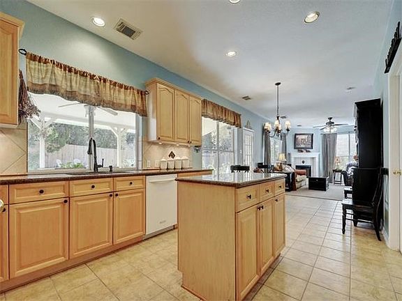 Granite counter tops with plenty of space with a ton of cabinets.   Window above your sink overlooks your peaceful private back yard