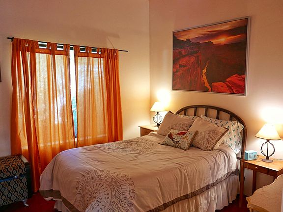 Cozy ground floor bedroom with full bed.