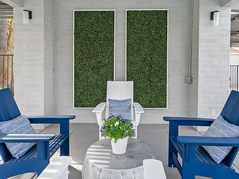 Unwind in a shaded lounge area, finding tranquility by the pool in an intimate setting.