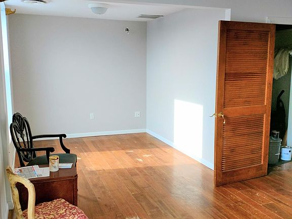 Bedroom area. Door leads to walk in closet.
