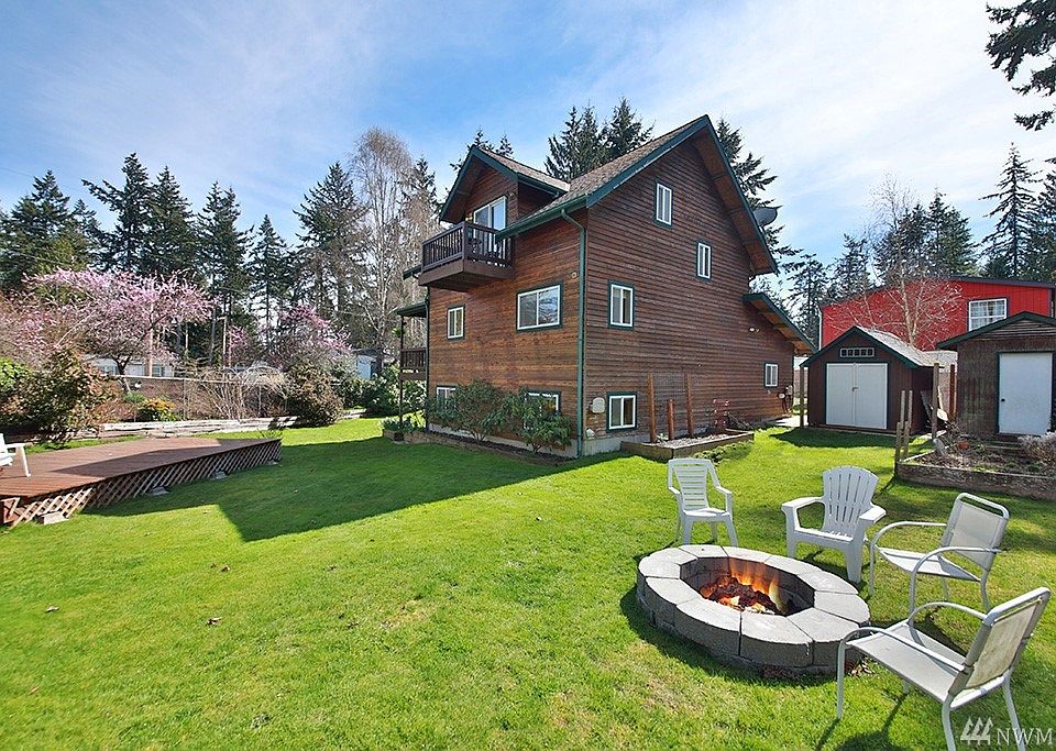 Corner lot w/ spacious fully fenced yard designed to maximize outside enjoyment.  Expansive deck, fire pit, two out buildings, and a hot water spigot for easy dog washing!