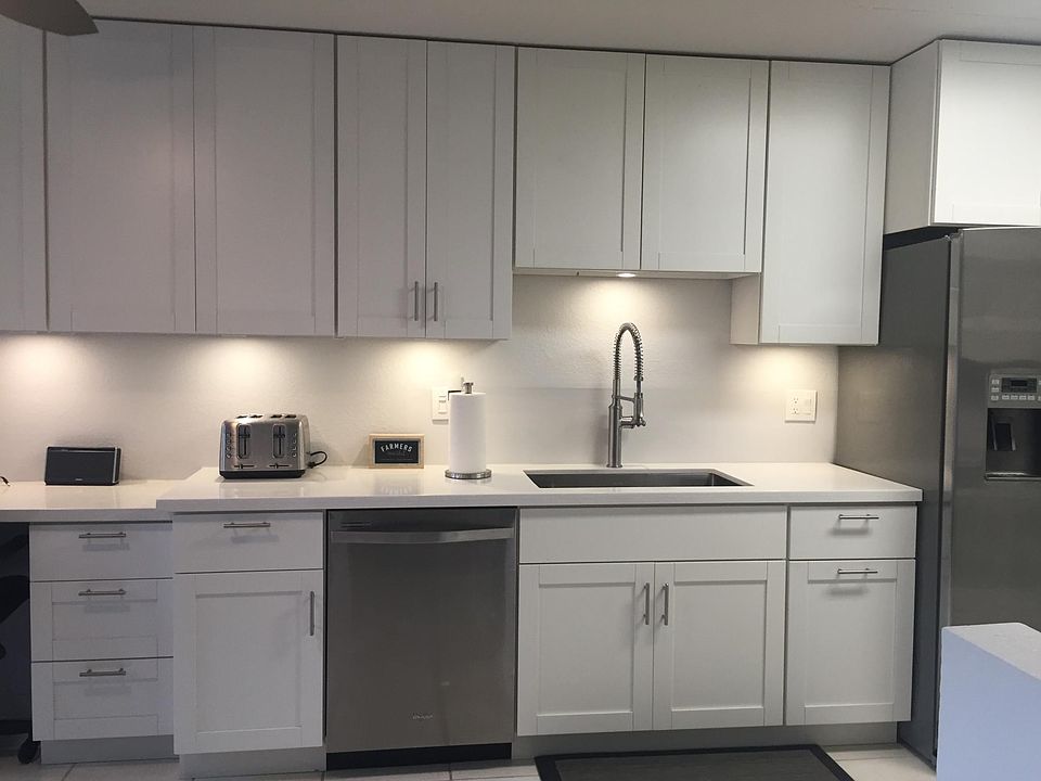 Upgraded kitchen - New, stainless steel appliances, white quartz counter tops, white shaker cabinets and deep sink.