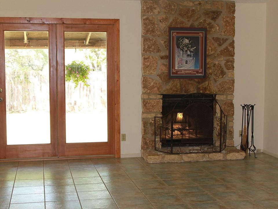 Living area offers vaulted ceilings, rock fireplace and recent atrium doors!
