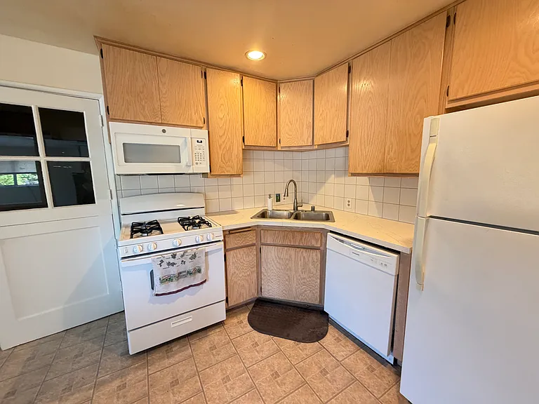 Kitchen with new countertops and appliances.