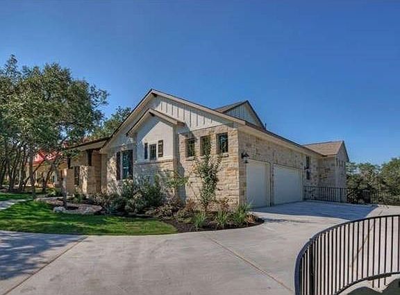 Over-sized 3 car garage with additional parking