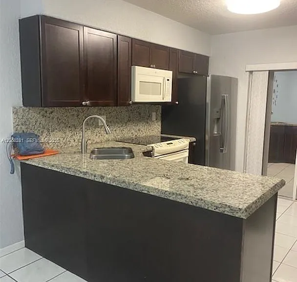 2390 W 74th St #202 — Photo 3