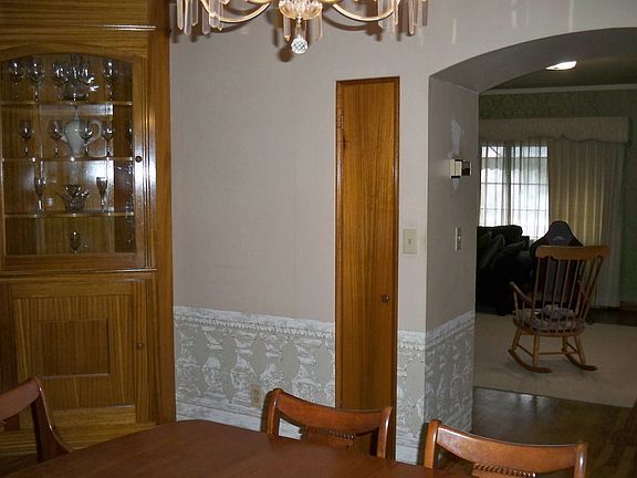 formal dining w/ beautiful crafted cabinets