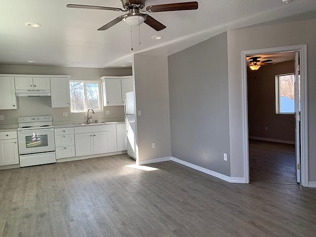 Part of front room and kitchen. Bedroom on the right Flooring is easy to keep clean