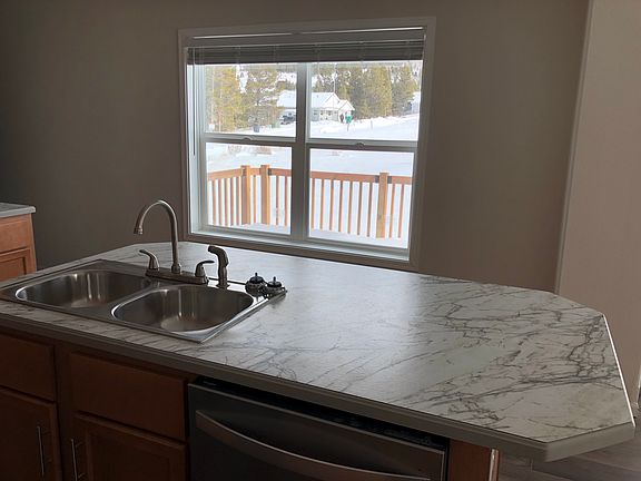 Kitchen sink and island, facing out to deck area