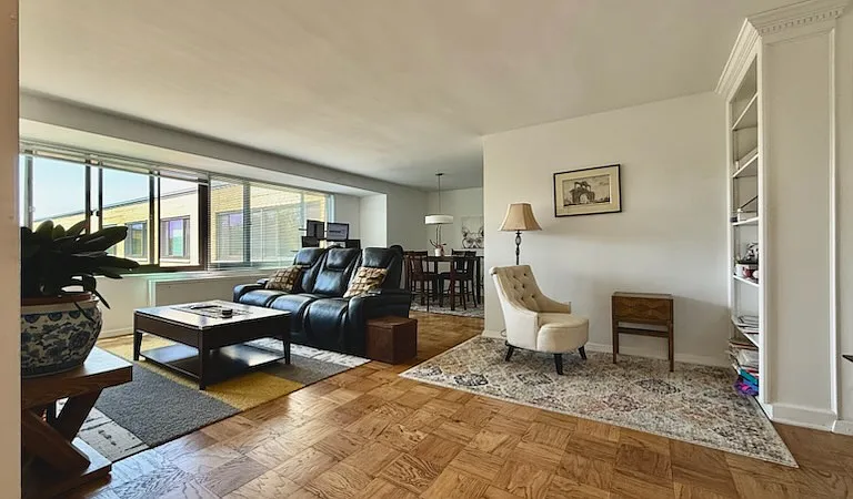 Reading nook with built-in bookshelves, living room, and dining area