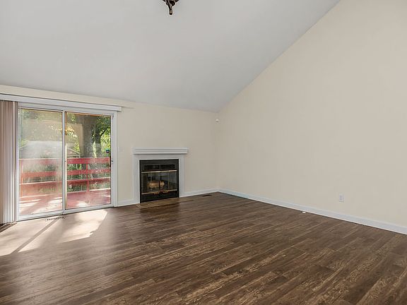 Sliding glass door open up to deck and fenced-in backyard. Also, fireplace in living room.