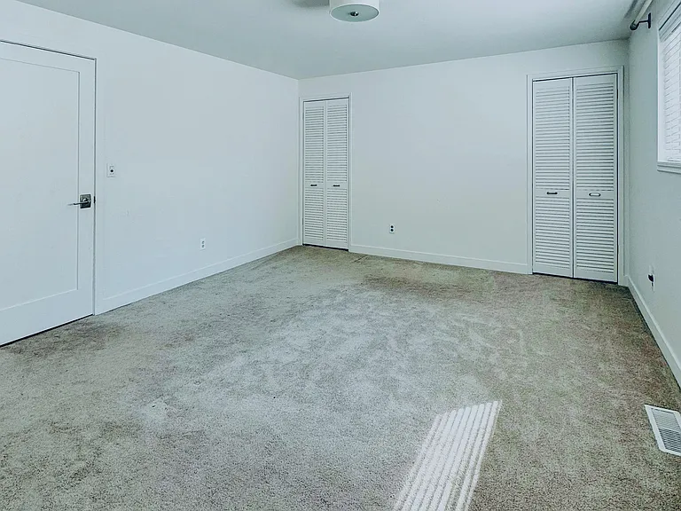 master bedroom with he she closet