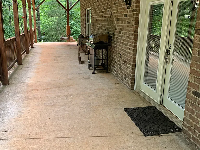 Private, covered patio for outdoor living protected from heat and rain.