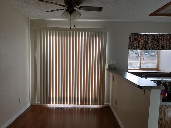 Dining room (main floor). Upper level deck behind blinds