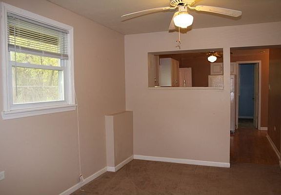 view from living room into dining room & kitchen