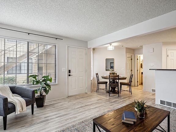 Light-filled living room with eating area in this open concept space.