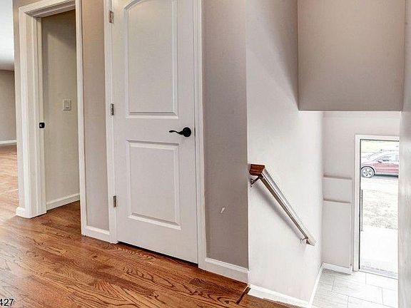 Entrance accessing living/dining room and facing access to the kitchen. The first door is a little closet the second one (the opened one) is a walk-in closet.