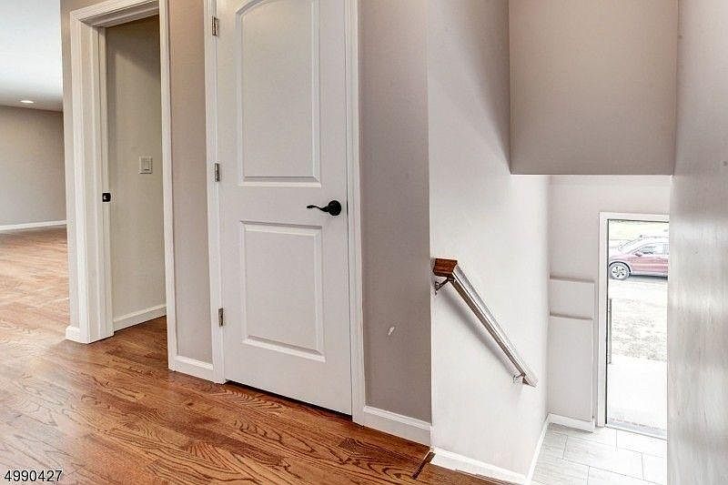 Entrance accessing living/dining room and facing access to the kitchen. The first door is a little closet the second one (the opened one) is a walk-in closet.