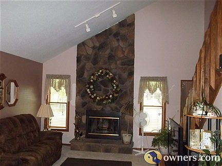 Living Room w/fireplace and Stairway