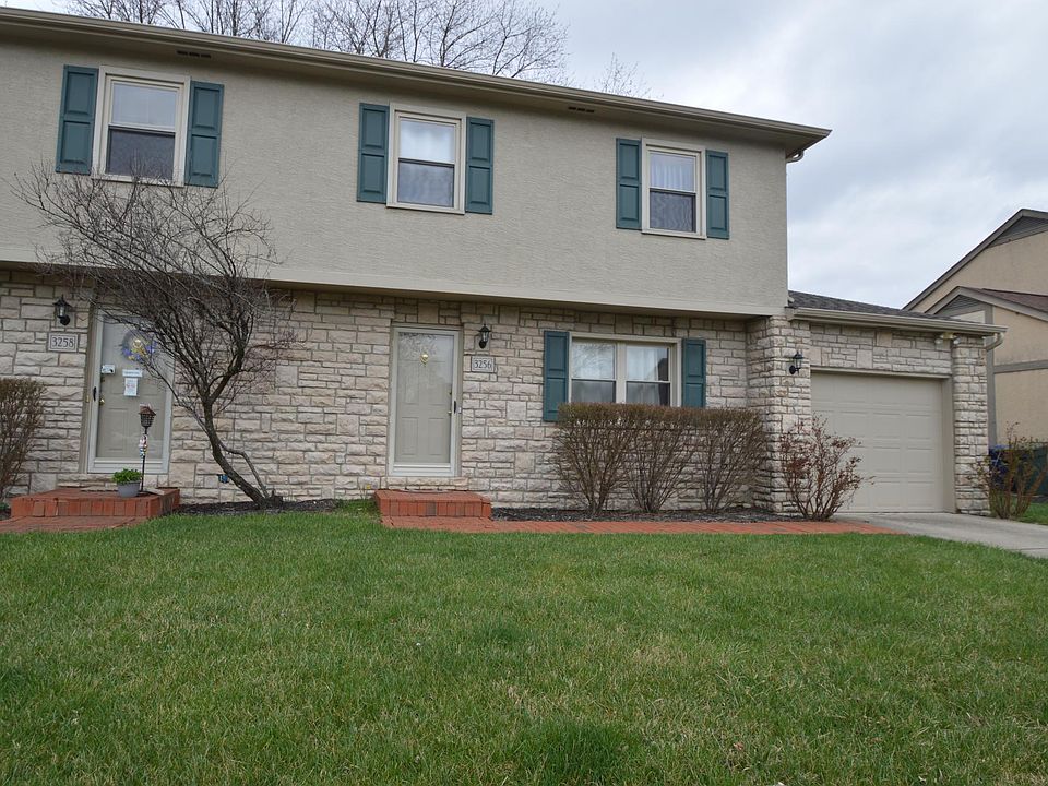 Home is the unit on the right with attached one-car garage