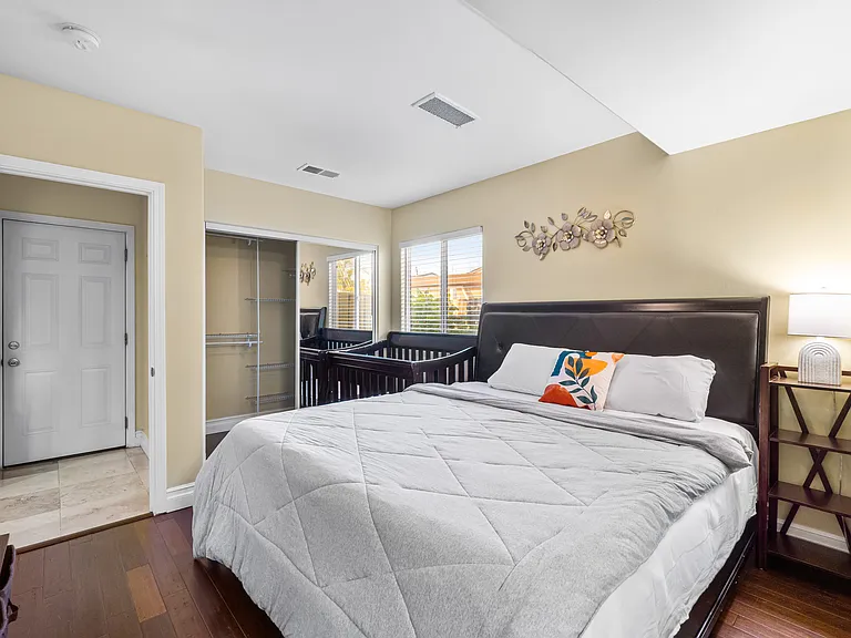 Master bedroom featuring a spacious closet for all your storage needs.
