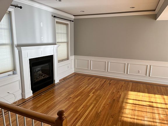Living room with gas fireplace and wired for large TV.