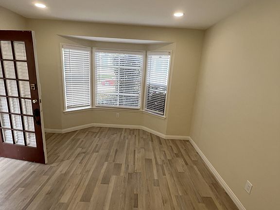 Living room from main entrance with updated recessed lighting.