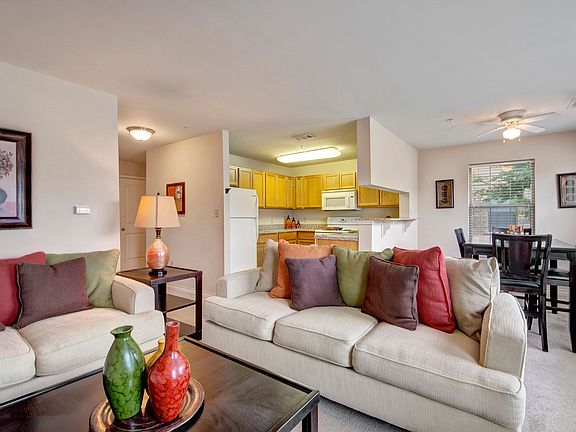 A cozy living room with easy access to the kitchen