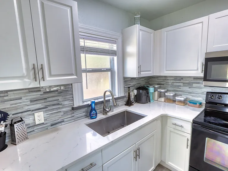 Unit is professionally staged; furniture and decor shown in photos are not included. Rented unfurnished.