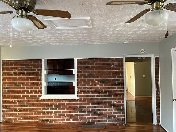 Den (Main entertainment room) with view into the kitchen and slight view into the living room