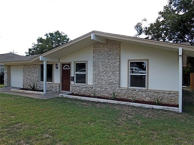 Front of home. Notice the reflective windows - provides privacy and energy savings.