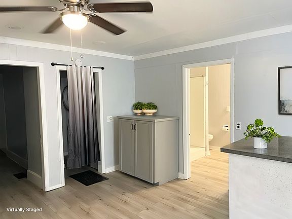 Kitchen with extra storage cabinet which can be used as a panty or additional storage