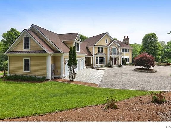 Belgium block lines the circular driveway and paves the entrance to the garage.