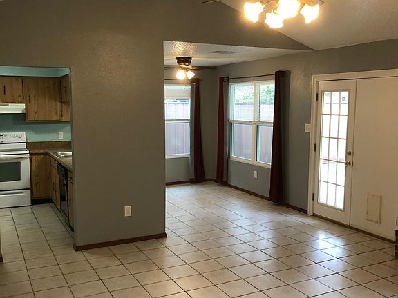 Original den dining room and rear door to the left of the entrance to the kitchen
