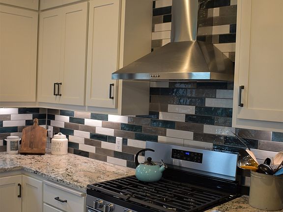 includes tile backsplash and under cabinet lighting