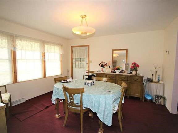 Separate 13x13 Formal Dining Room w/ 3 Newer Windows in Back overlooking Private acreage and allowing plenty of Natural Light to